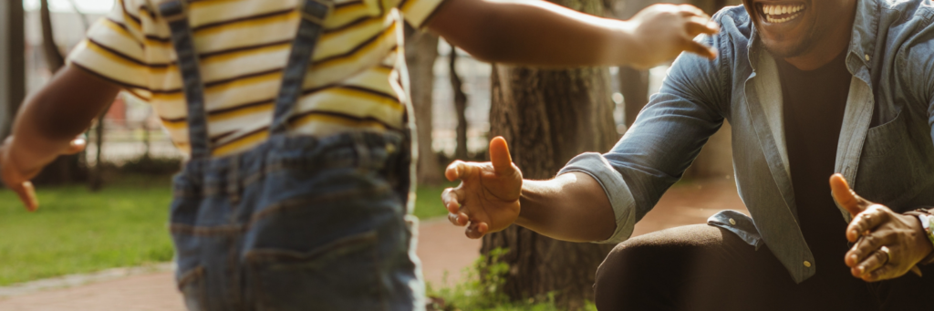 kid running to man for a hug